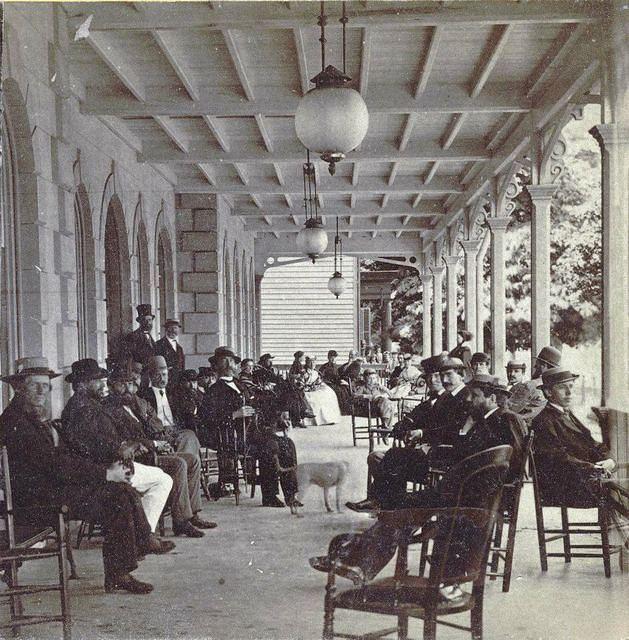 On the front porch of the Wyoming Valley House (Hotel) on South River Street in Wilkes-Barre - where Guard Insurance Company building is today. c. 1880s